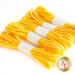 Five bundles of yellow elastic strips, each secured with a white band, arranged neatly against a light background.