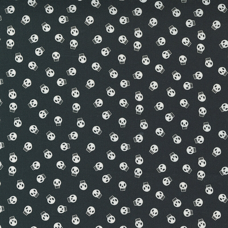 White skulls on a black background