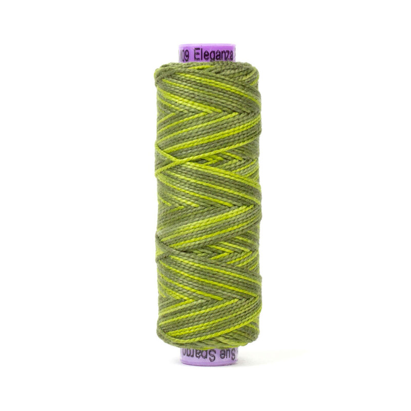 A spool of WonderFil Eleganza EZM09 Up A Tree thread on a white background