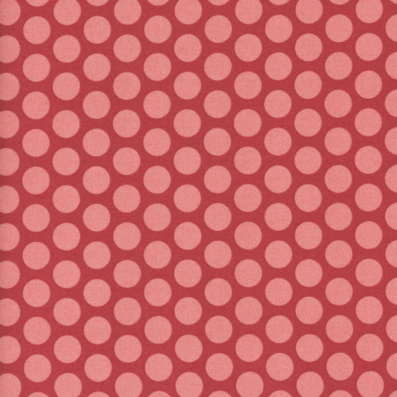 Pink polka dots on red fabric