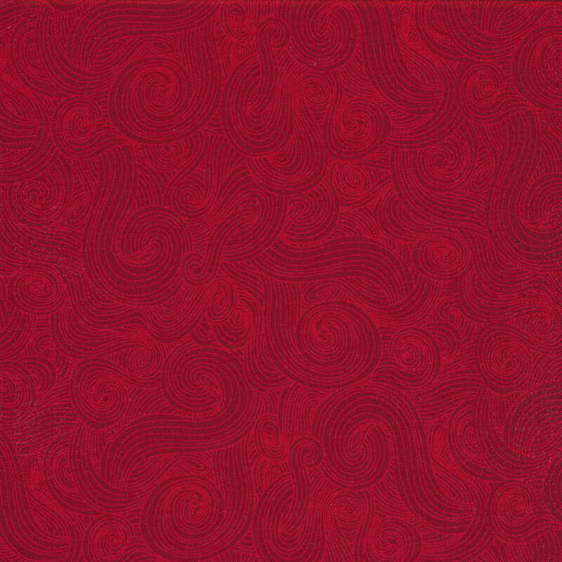 Tonal burgundy fabric with dark swirls on a lighter background 