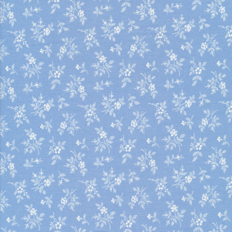 White florals tossed on a blue background
