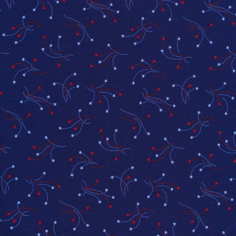 Red and white star burst pattern on dark blue fabric background