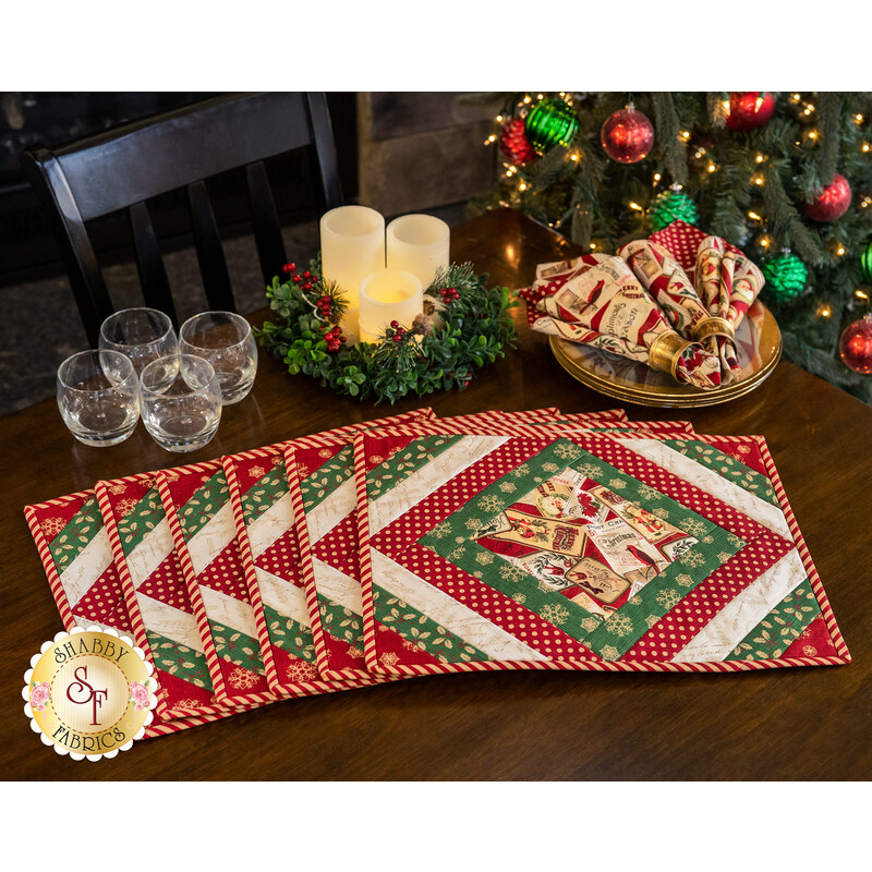 Holiday themed placemats arranged on table with matching napkins