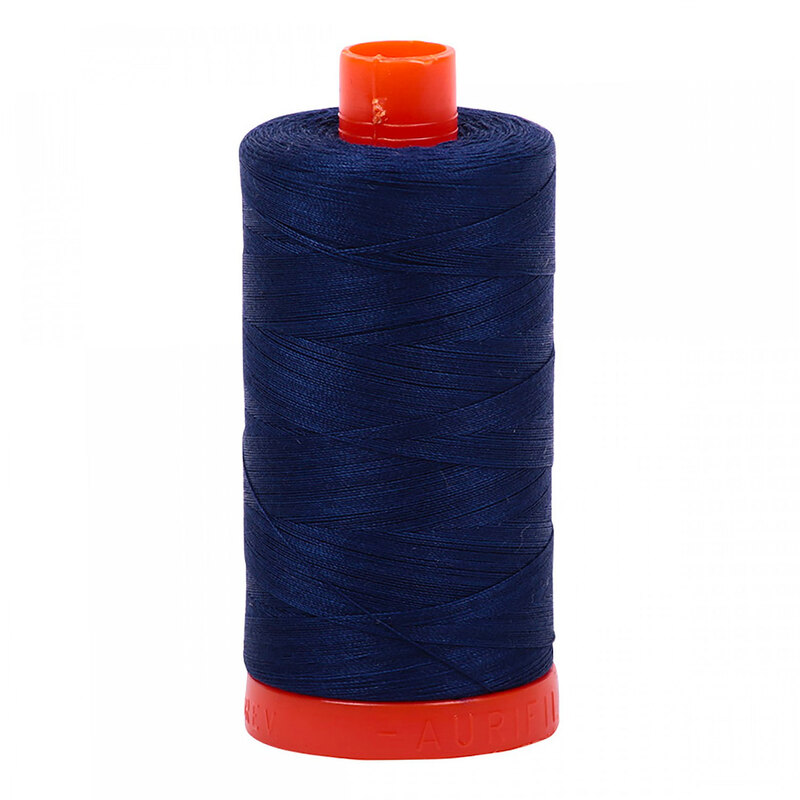 A spool of Dark Navy Aurifil Thread on a white background