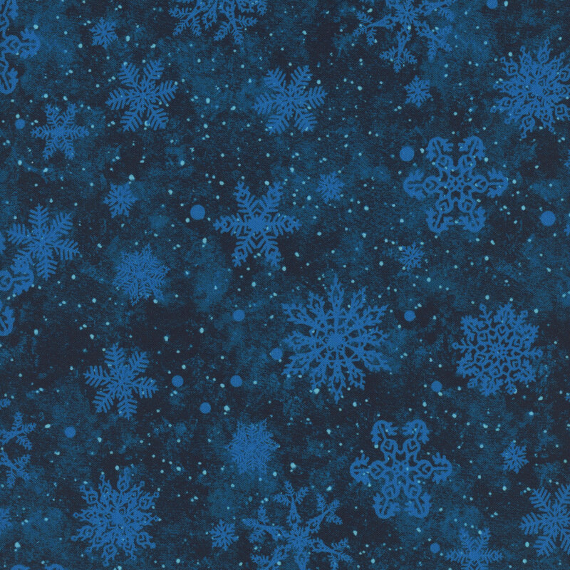 Dark blue mottled fabric with blue snowflakes