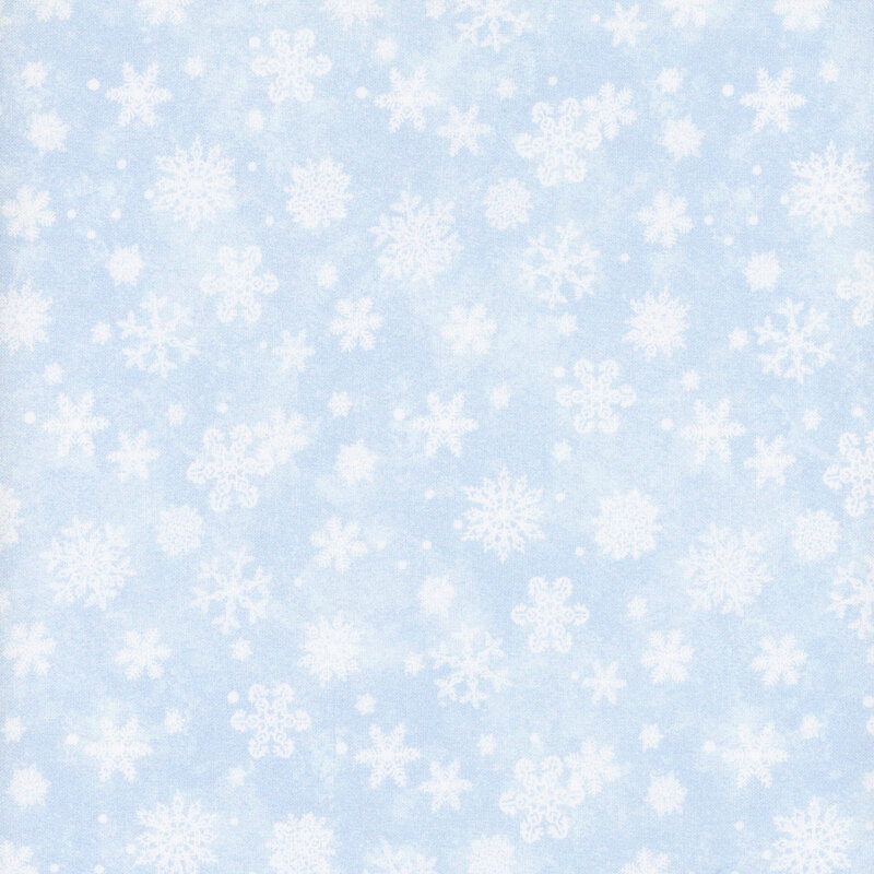 Mottled light blue fabric with white snowflakes throughout