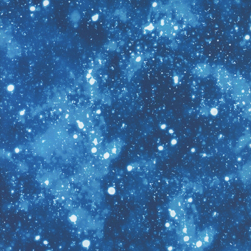 Blue mottled fabric with snowballs scattered
