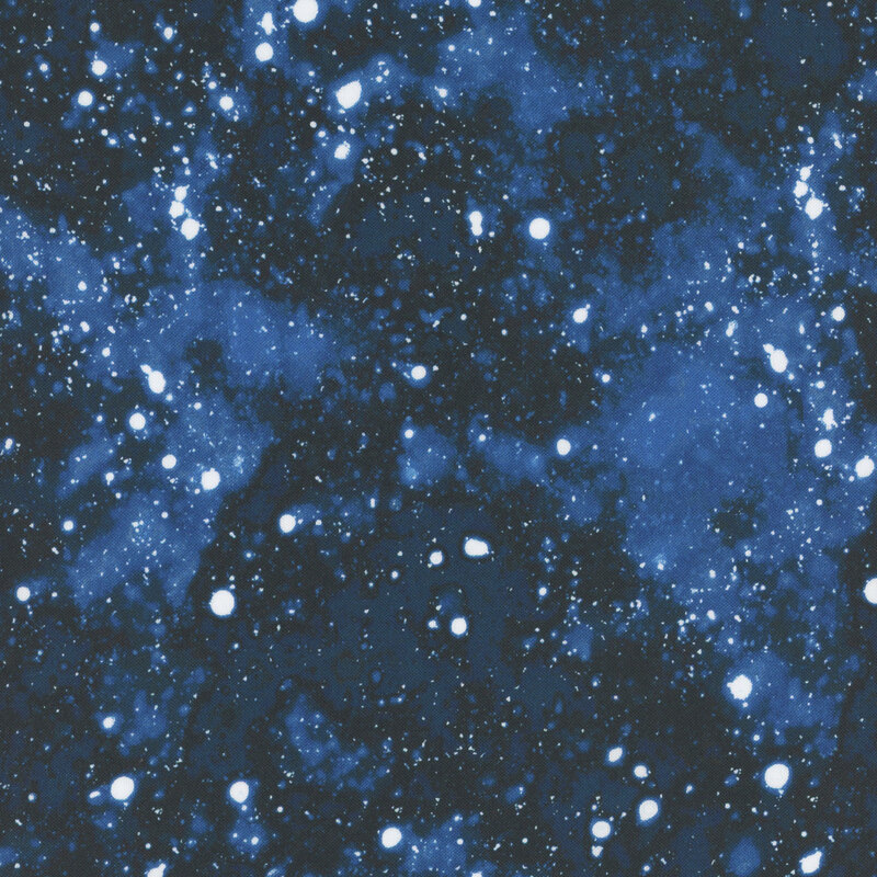 Dark blue mottled fabric with white snow balls scattered 