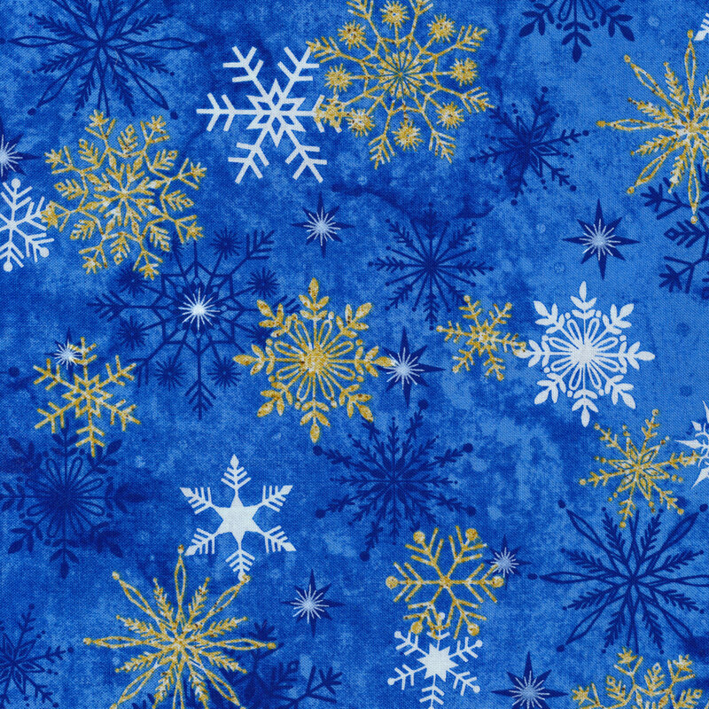 Blue mottled fabric with white and metallic gold snowflakes