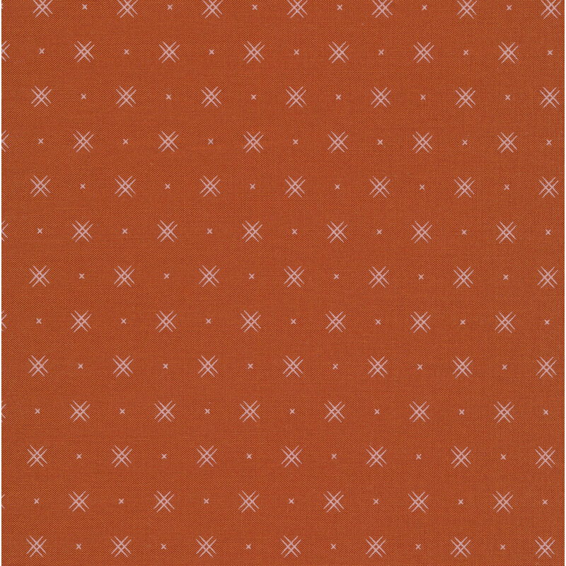 Brown fabric with rows of small white x's and double criss-cross patterns