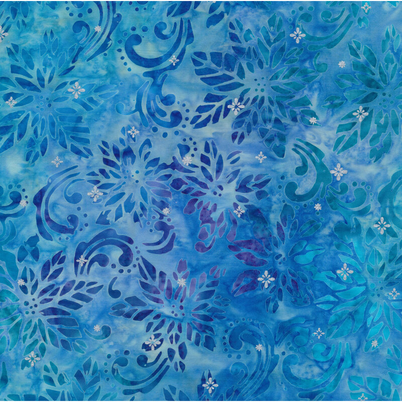 Light blue mottled batik fabric with tonal poinsettias and swirls with small gold stars