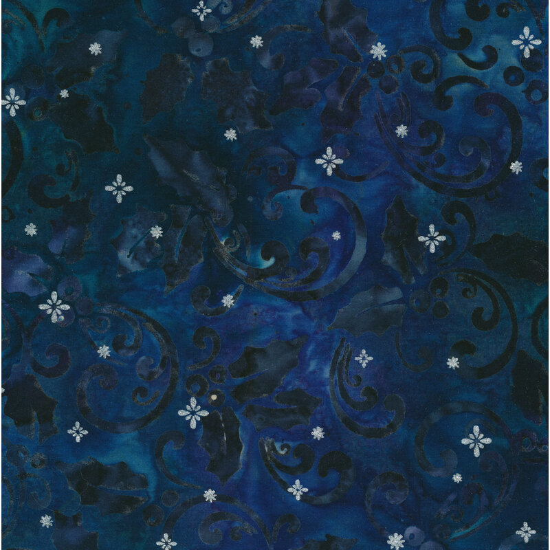 Dark blue batik fabric with dark scrolls and holly leaves and small silver stars
