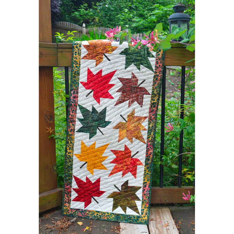 The finished Maple Leaf Runner draped over a railing outdoors