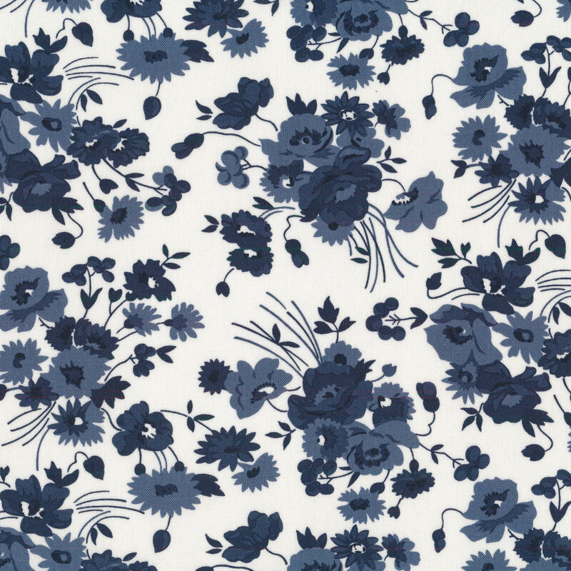 Navy blue floral bunches tossed on an cream background