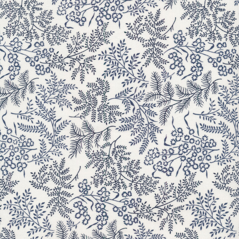 Fabric with navy blue leaves and vines all over a cream background