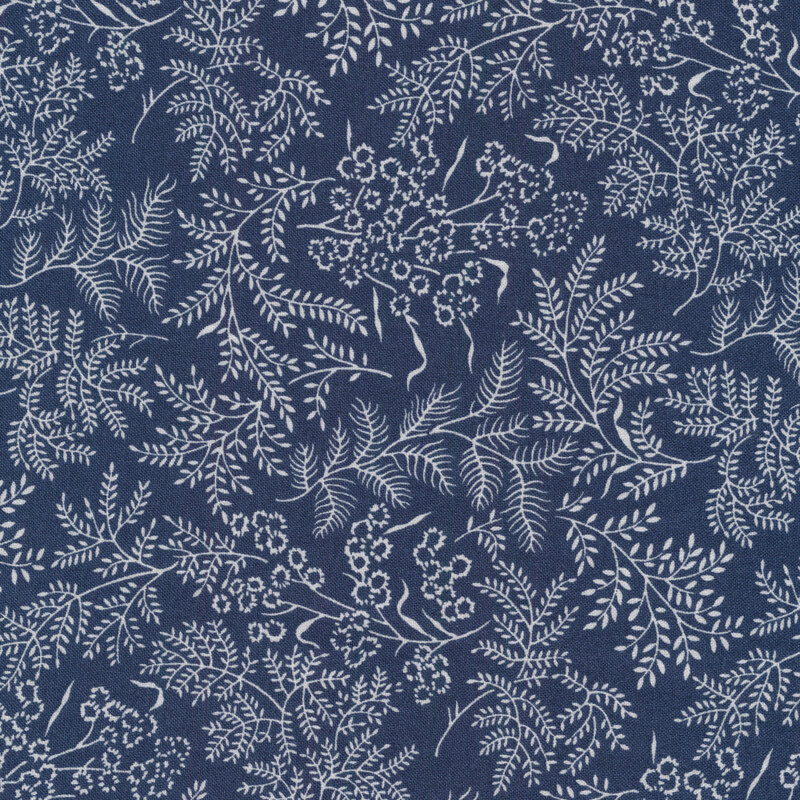 Fabric with white leaves and vines all over a dark navy background