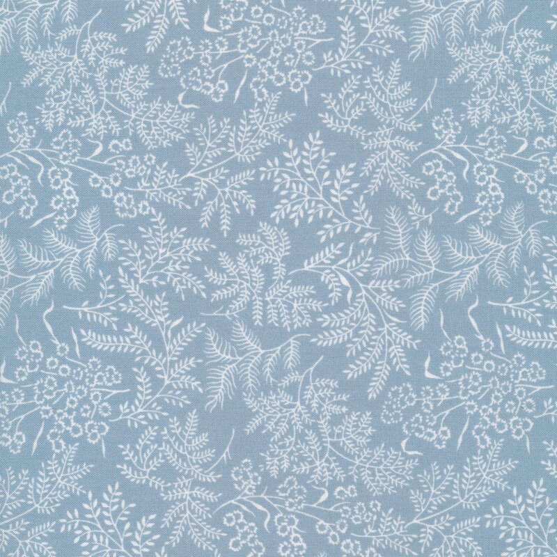 Fabric with white leaves and vines all over a light blue background