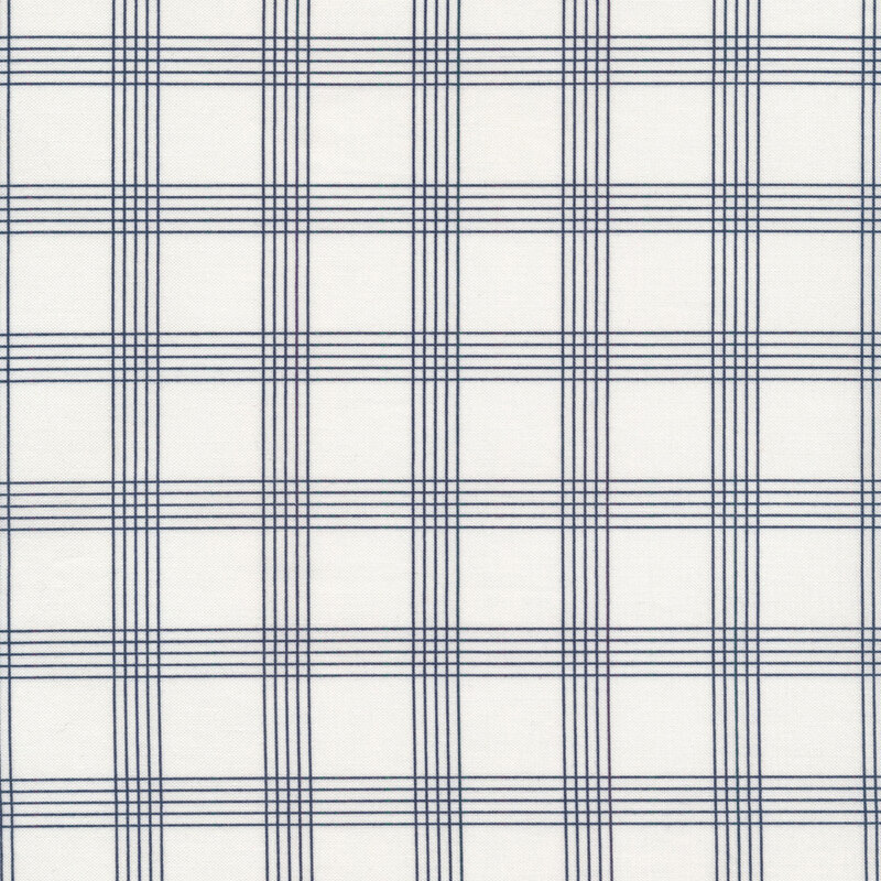 Fabric with navy blue plaid lines all over a cream background