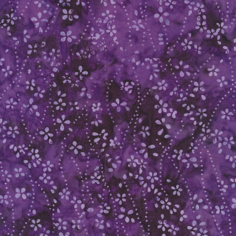 Light purple flowers and dots on a dark purple Batik fabric background.