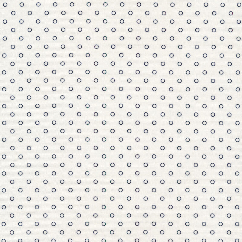 Cream fabric with navy blue circle dots all over