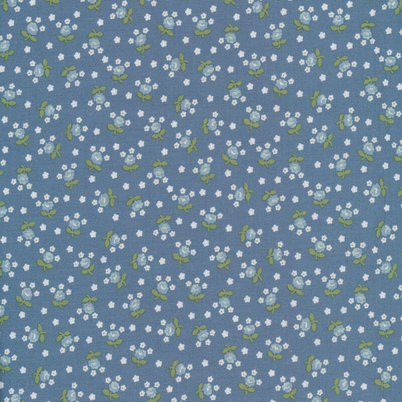 Fabric with tossed white and light blue flowers on a blue background.