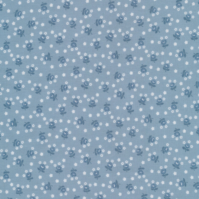 Fabric with tossed white and blue flowers on a light blue background.