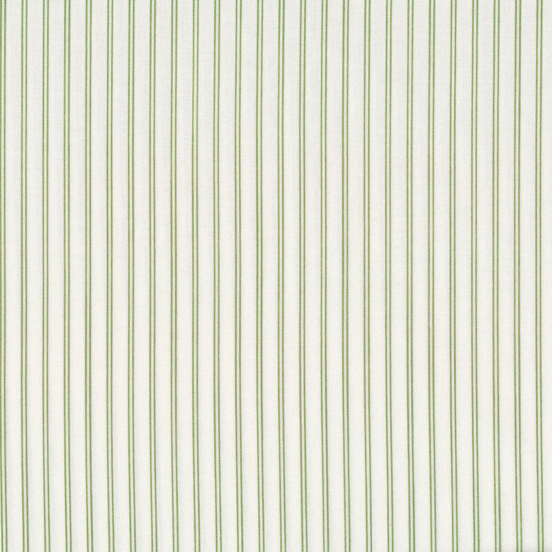 Fabric with green stripes all over a cream background