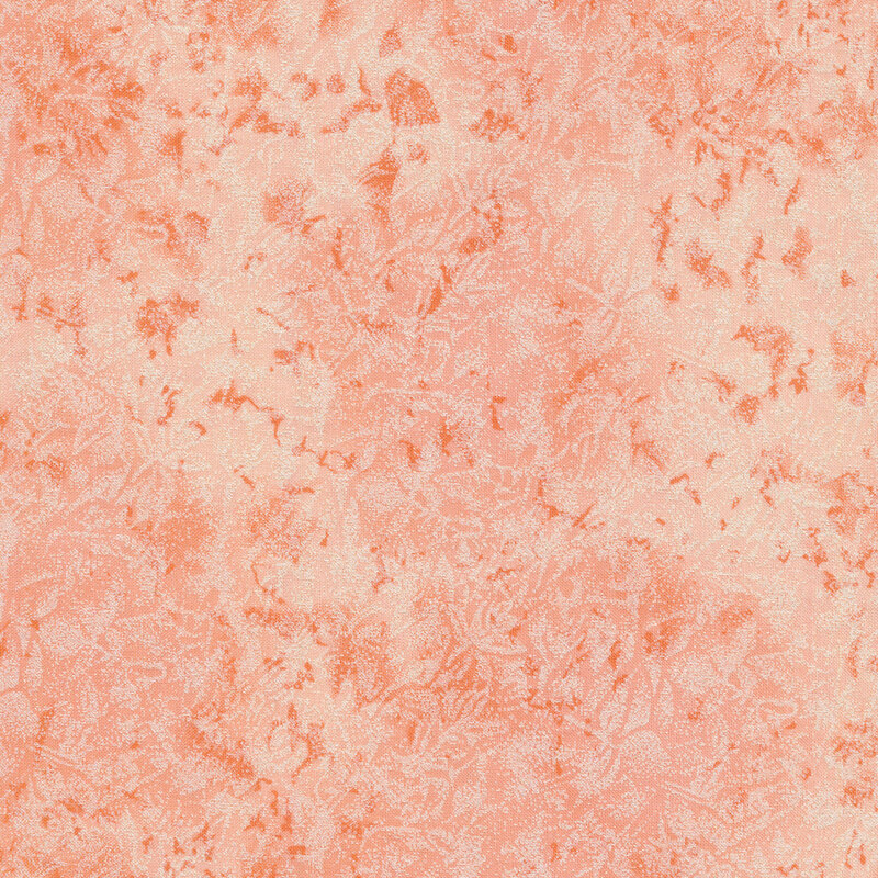 Tonal peach fabric features mottled design with metallic accents