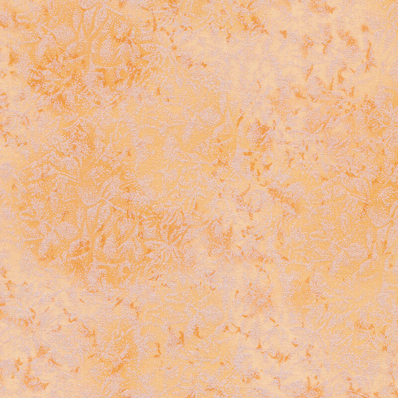 Tonal light carrot colored fabric features mottled design with metallic accents