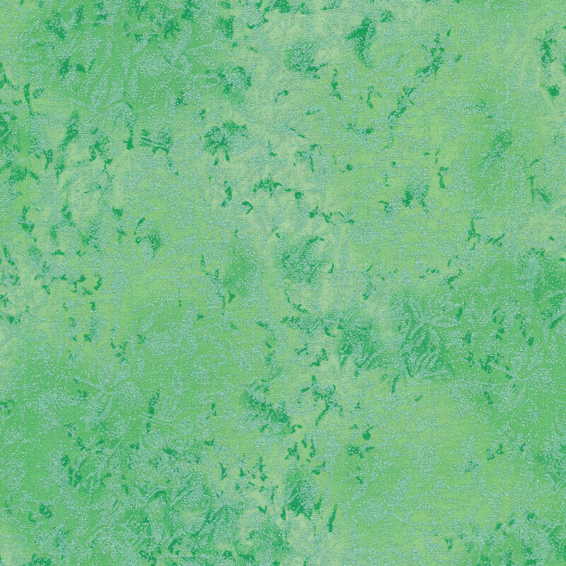 Tonal mint green colored fabric features mottled design with metallic accents