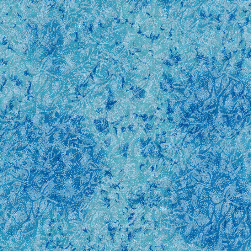 Tonal ocean blue colored fabric features mottled design with metallic accents