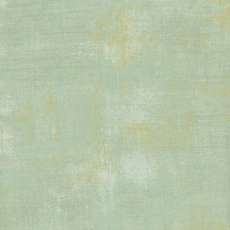 Mint grunge fabric swatch with tonal and golden texture accents.