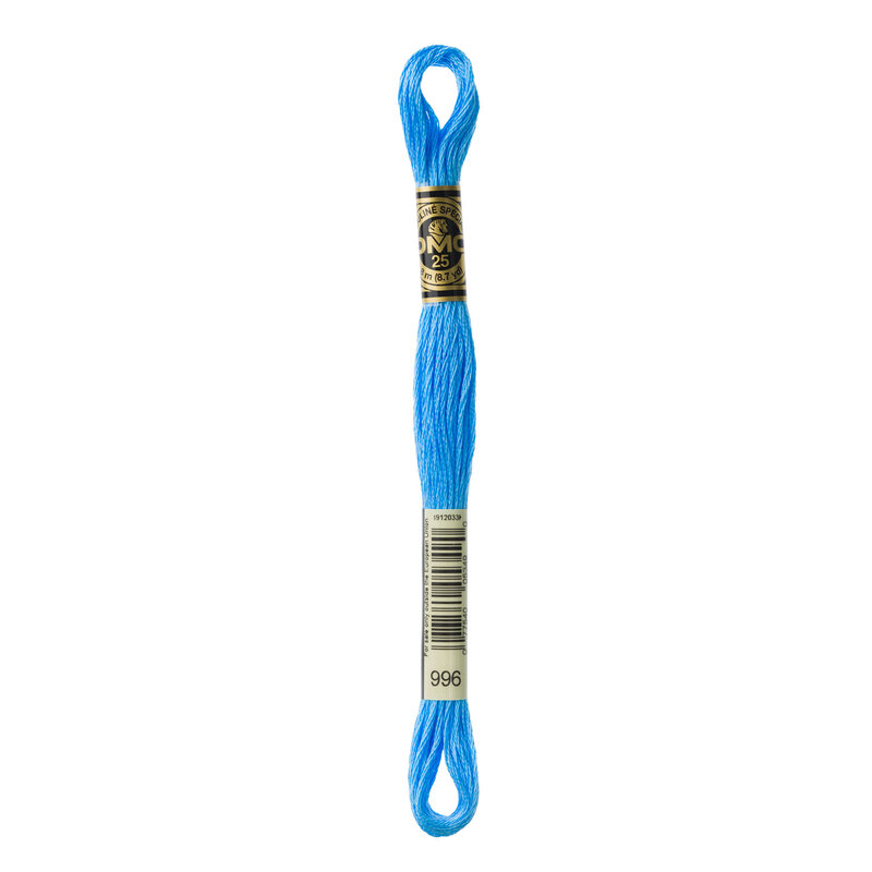 A skein of light blue embroidery floss with a gold and black brand label and a barcode.