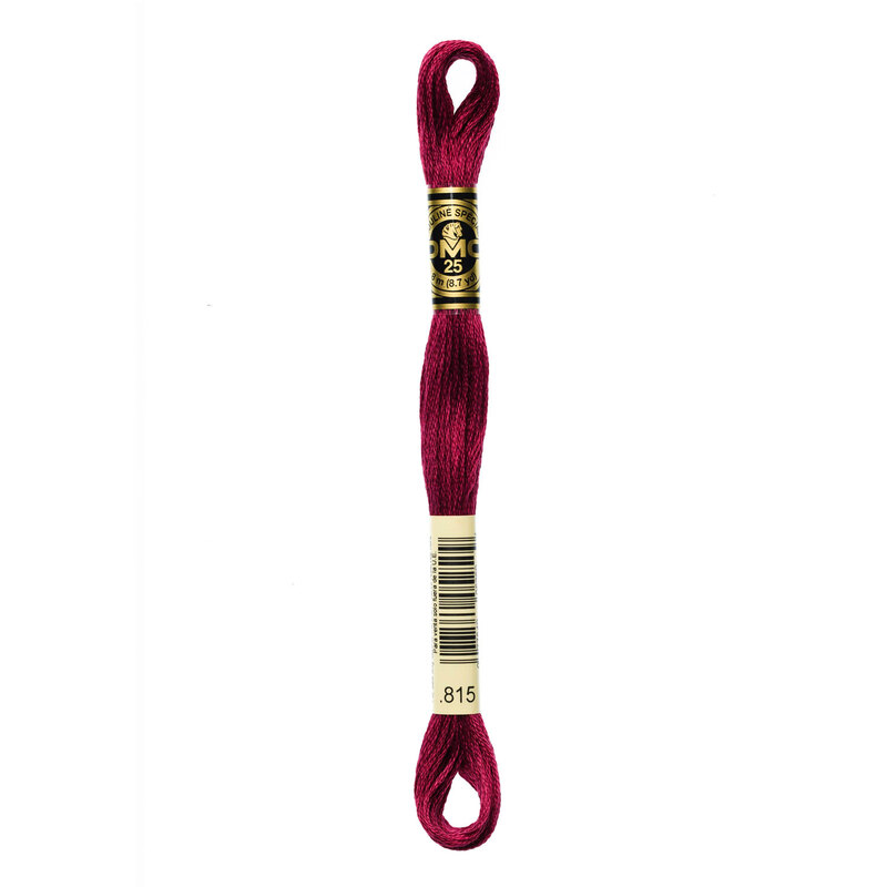 A skein of DMC 815 Medium Garnet 6 strand embroidery floss