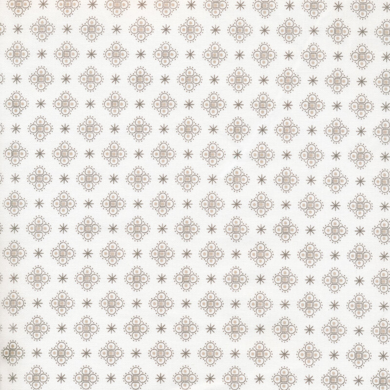 asterisks and medallions on a white fabric background