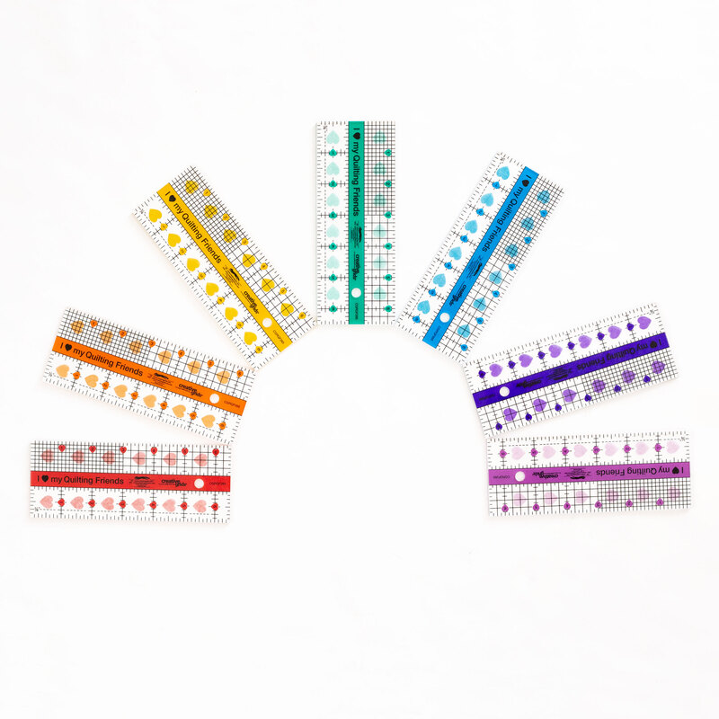 seven grid rulers measuring 2-1/2