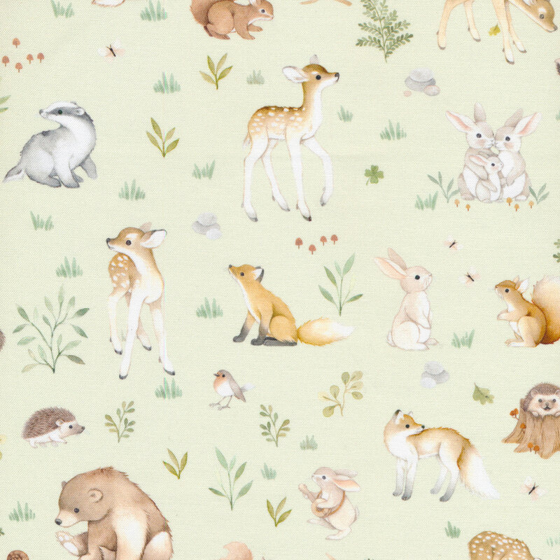 Light green fabric with young woodland animals and small leaves and flowers