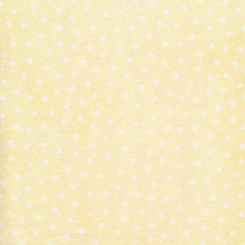 yellow flannel fabric with white polka dots all over