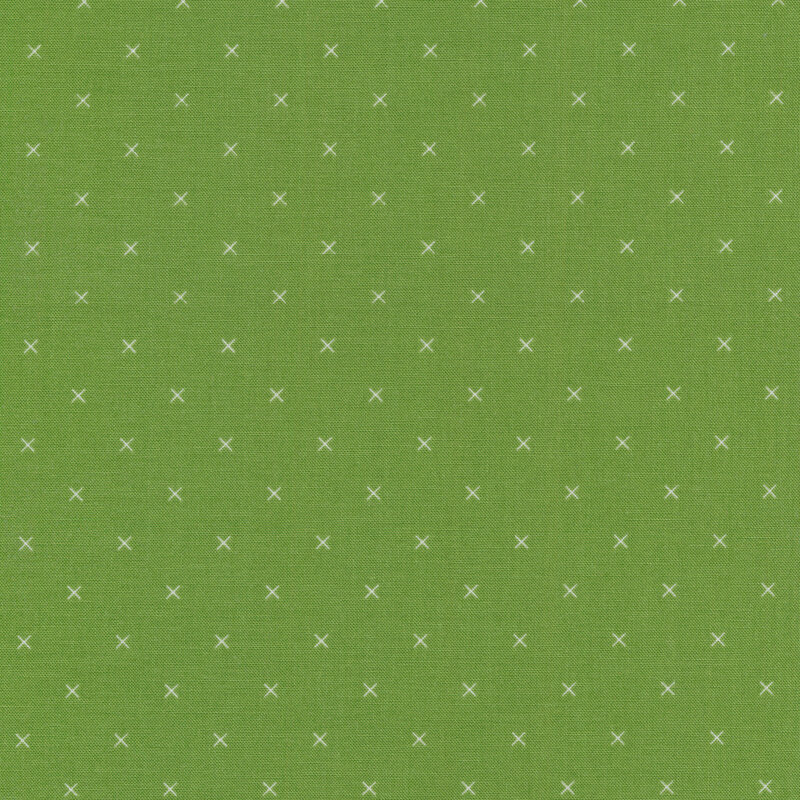 Small cream x's on a green background