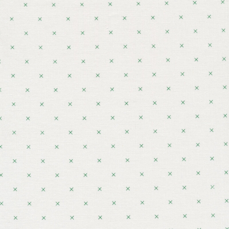 Small green x's on a cream background