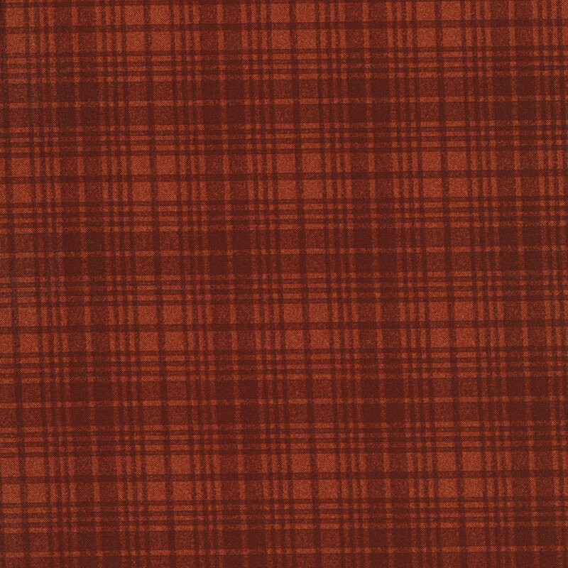 A burnt orange tonal plaid fabric