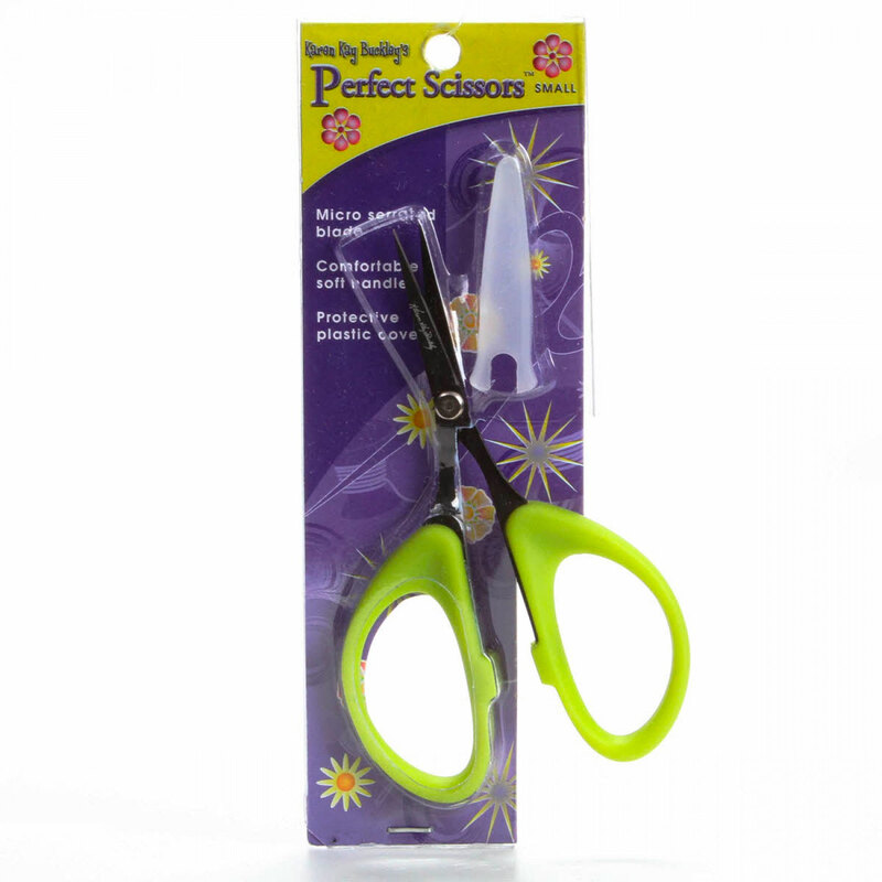 Packaging of small scissors with green handles and protective plastic tip, labeled Karen Kay Buckley Perfect Scissors.