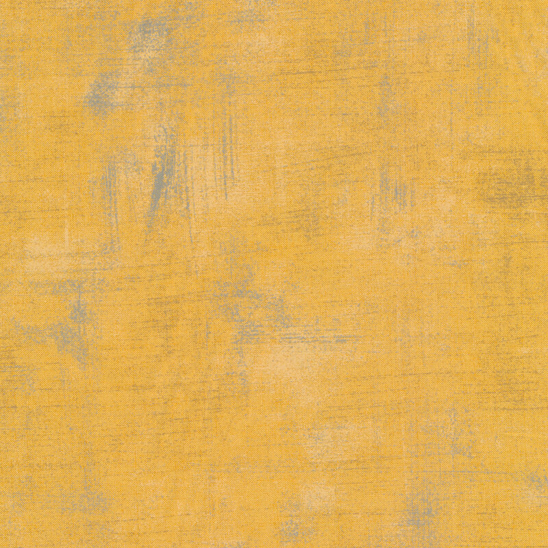 Golden yellow fabric with bits of grunge texturing