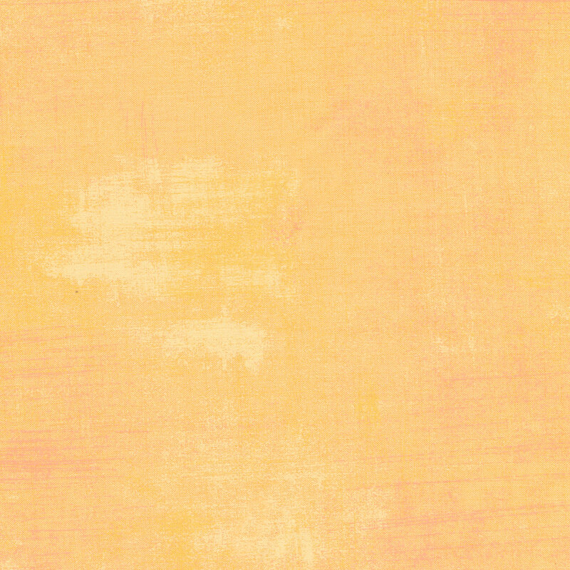 Light peach fabric with bits of light cream grunge texturing