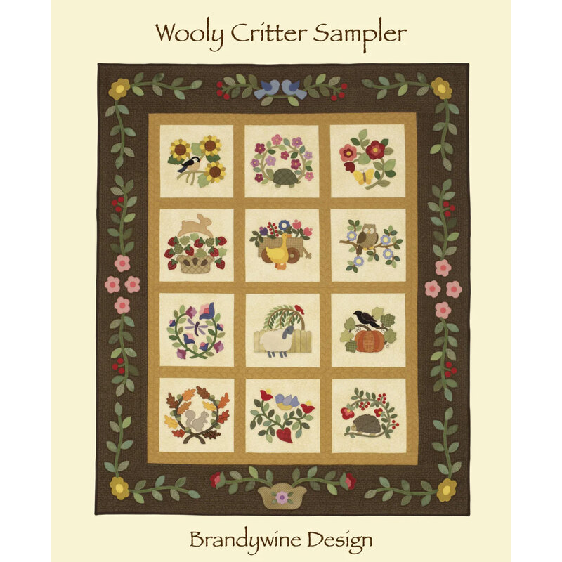 Wooly Critter Sampler Pattern front cover showing al 12 blocks of the quilt with the floral outer border.