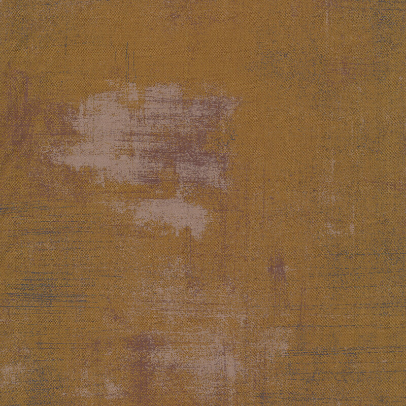 A brown textured fabric with pale purple grunge texturing