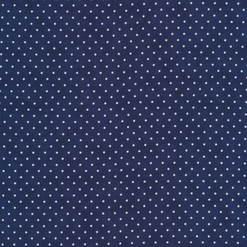 navy blue fabric with small white polka dots throughout