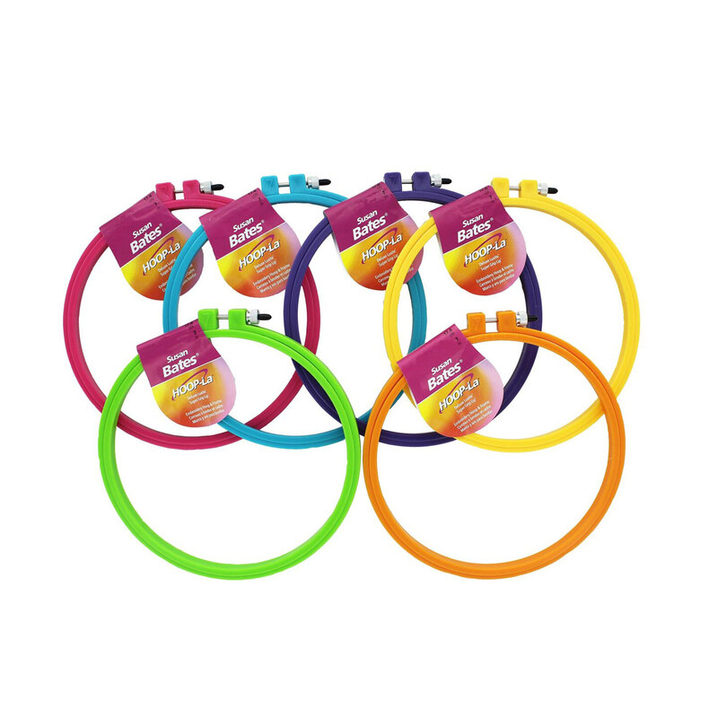 An assortment of colorful Hoop-la embroidery hoops on a white background