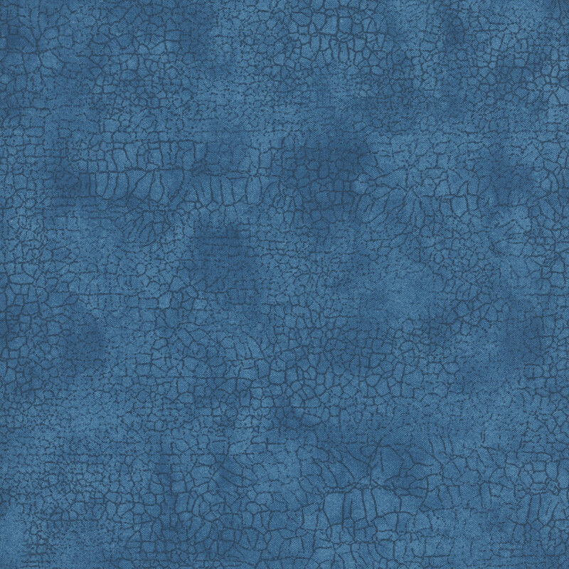 Mottled tonal blue fabric features crackle texture design